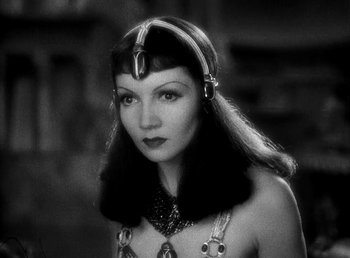 Movie still from “Cleopatra” (1934), directed by Cecil B. DeMille – A black and white photo of a woman in a costume; Close Up shot, Low angle