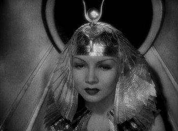 Movie still from “Cleopatra” (1934), directed by Cecil B. DeMille – A woman with a headdress and a necklace; Close Up shot, High angle