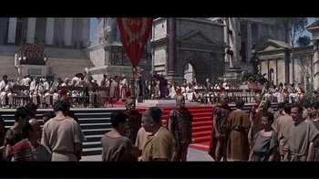 Movie still from “Cleopatra” (1963), directed by Rouben Mamoulian – A group of people standing around a building; Extreme Wide shot, High angle