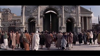 Movie still from “Cleopatra” (1963), directed by Rouben Mamoulian – A group of people walking in front of a large building; Extreme Wide shot, Low angle