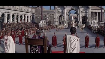 Movie still from “Cleopatra” (1963), directed by Rouben Mamoulian – A crowd of people are gathered in a courtyard; Extreme Wide shot, High angle