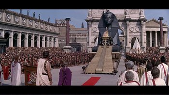 Movie still from “Cleopatra” (1963), directed by Rouben Mamoulian – A crowd of people standing in front of a statue of a sphinx; Extreme Wide shot, High angle