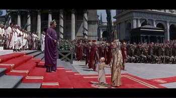 Movie still from “Cleopatra” (1963), directed by Rouben Mamoulian – A group of people standing in front of a crowd; Extreme Wide shot, High angle