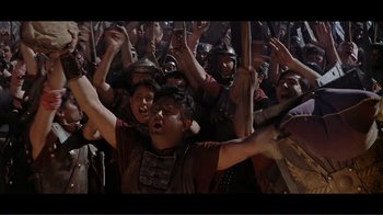 Movie still from “Cleopatra” (1963), directed by Rouben Mamoulian – A group of people are gathered together in a crowd; Wide shot, High angle