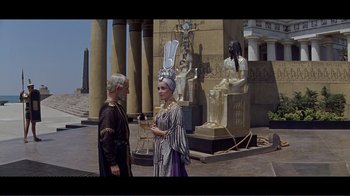 Movie still from “Cleopatra” (1963), directed by Rouben Mamoulian – A man and a woman dressed in ancient clothing; Wide shot, High angle
