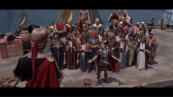 Movie still from “Cleopatra” (1963), directed by Rouben Mamoulian – A group of people standing in front of an audience; Extreme Wide shot, High angle