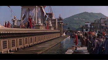 Movie still from “Cleopatra” (1963), directed by Rouben Mamoulian – A group of people standing on the side of a body of water; Extreme Wide shot, High angle