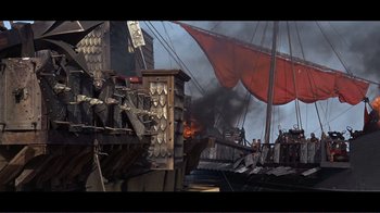 Movie still from “Cleopatra” (1963), directed by Rouben Mamoulian – An image of a pirate ship in the middle of the ocean; Extreme Wide shot, High angle