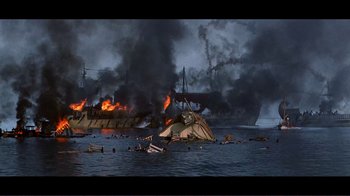 Movie still from “Cleopatra” (1963), directed by Rouben Mamoulian – A boat is burning in the ocean with people swimming in it; Extreme Wide shot, High angle