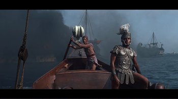 Movie still from “Cleopatra” (1963), directed by Rouben Mamoulian – Two men are in a boat in the middle of the ocean; Wide shot, Low angle