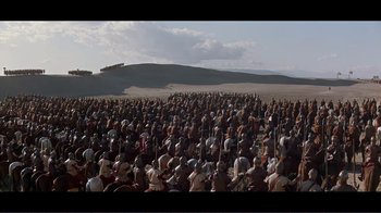 Movie still from “Cleopatra” (1963), directed by Rouben Mamoulian – A large group of people standing in a field; Extreme Wide shot, High angle