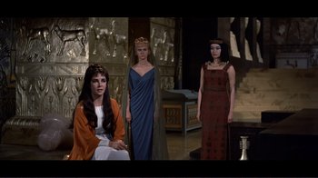 Movie still from “Cleopatra” (1963), directed by Rouben Mamoulian – A group of women standing next to each other in a room; Medium shot, High angle
