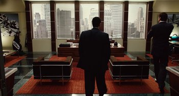 Movie still from “Click” (2006), directed by Frank Coraci – A man standing in front of a window; Wide shot, High angle