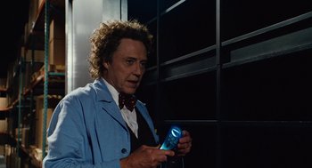 Movie still from “Click” (2006), directed by Frank Coraci – A man in a blue jacket holding a cell phone in his hand; Close Up shot, Over the shoulder angle