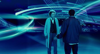 Movie still from “Click” (2006), directed by Frank Coraci – Two men are standing in a room with a blue background; Wide shot, Over the shoulder angle