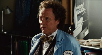 Movie still from “Click” (2006), directed by Frank Coraci – A person wearing a suit and a bow tie; Close Up shot, Low angle