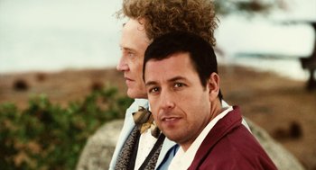 Movie still from “Click” (2006), directed by Frank Coraci – Two men are posing for a picture together; Close Up shot, Over the shoulder angle