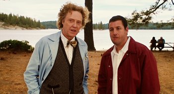 Movie still from “Click” (2006), directed by Frank Coraci – Two men standing next to each other near a body of water; Medium shot, Over the shoulder angle