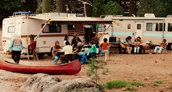 Movie still from “Click” (2006), directed by Frank Coraci – A group of people sitting in front of an rv; Wide shot, High angle