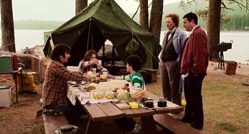 Movie still from “Click” (2006), directed by Frank Coraci – A group of people gathered around a picnic table; Wide shot, Over the shoulder angle