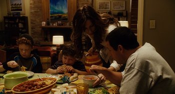 Movie still from “Click” (2006), directed by Frank Coraci – A family sitting at a dinner table eating food; Medium shot, High angle
