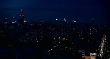 Movie still from “Click” (2006), directed by Frank Coraci – A view of a large city at night with lights on; Extreme Wide shot, High angle