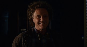 Movie still from “Click” (2006), directed by Frank Coraci – A person wearing a jacket and a bow tie; Close Up shot, Low angle