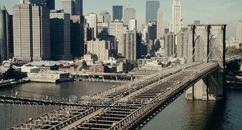 Movie still from “Click” (2006), directed by Frank Coraci – A view of a city from a bridge over a river; Extreme Wide shot, High angle