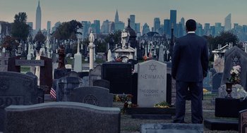 Movie still from “Click” (2006), directed by Frank Coraci – A man standing in front of a grave in a cemetery; Extreme Wide shot, Over the shoulder angle