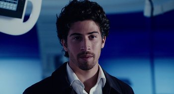 Movie still from “Click” (2006), directed by Frank Coraci – A person wearing a suit and tie; Close Up shot, Over the shoulder angle