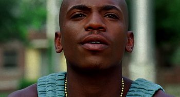 Movie still from “Clockers” (1995), directed by Spike Lee – A person wearing a necklace; Close Up shot, Low angle