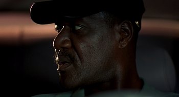Movie still from “Clockers” (1995), directed by Spike Lee – A person wearing a hat; Close Up shot, Low angle