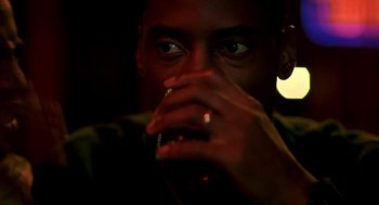 Movie still from “Clockers” (1995), directed by Spike Lee – A person holding a cell phone; Close Up shot, Over the shoulder angle