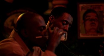 Movie still from “Clockers” (1995), directed by Spike Lee – Two men are smoking and eating food; Close Up shot, Over the shoulder angle