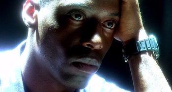 Movie still from “Clockers” (1995), directed by Spike Lee – A man's face in the sunlight; Extreme Close Up shot, Low angle