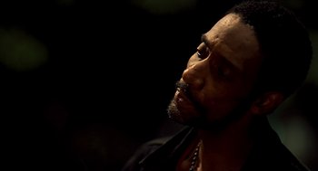 Movie still from “Clockers” (1995), directed by Spike Lee – A person with a beard; Close Up shot, Low angle