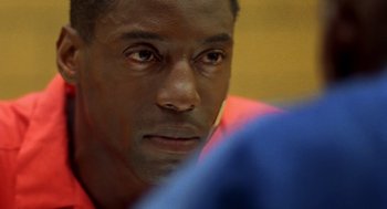 Movie still from “Clockers” (1995), directed by Spike Lee – A man's face looking at the camera; Extreme Close Up shot, Low angle