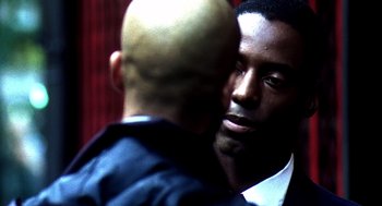 Movie still from “Clockers” (1995), directed by Spike Lee – Two men are facing each other in a room; Close Up shot, Over the shoulder angle