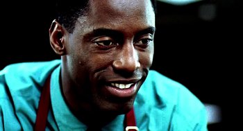Movie still from “Clockers” (1995), directed by Spike Lee – A person wearing a shirt and a tie; Close Up shot, Low angle