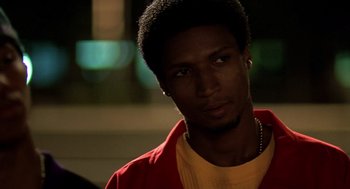 Movie still from “Clockers” (1995), directed by Spike Lee – A young man with a yellow shirt and a red shirt; Close Up shot, Low angle