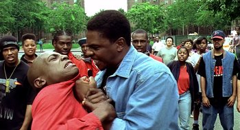 Movie still from “Clockers” (1995), directed by Spike Lee – A couple of people that are in the street; Close Up shot, Over the shoulder angle