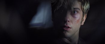 Movie still from “Death Note” (2017), directed by Adam Wingard – A young man with blonde hair is looking at the camera; Close Up shot, Low angle