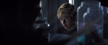 Movie still from “Death Note” (2017), directed by Adam Wingard – A man with blonde hair looking into a bathroom mirror; Close Up shot, Over the shoulder angle