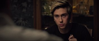 Movie still from “Death Note” (2017), directed by Adam Wingard – A man with blonde hair is looking at the camera; Close Up shot, Over the shoulder angle
