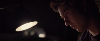 Movie still from “Death Note” (2017), directed by Adam Wingard – A man's face in the dark; Close Up shot, Over the shoulder angle