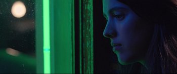 Movie still from “Death Note” (2017), directed by Adam Wingard – A woman looking out of a window at night; Close Up shot, Over the shoulder angle