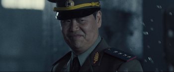 Movie still from “Death Note” (2017), directed by Adam Wingard – A person wearing a military uniform; Close Up shot, Low angle