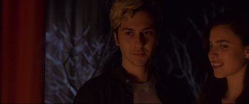 Movie still from “Death Note” (2017), directed by Adam Wingard – A young man with blonde hair is looking at the camera; Close Up shot, Over the shoulder angle