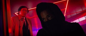 Movie still from “Death Note” (2017), directed by Adam Wingard – A man in a black veil standing in front of a woman; Close Up shot, Low angle