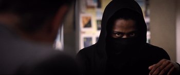 Movie still from “Death Note” (2017), directed by Adam Wingard – A man in a black hooded jacket looking at a camera; Close Up shot, Over the shoulder angle